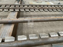 Discharging Beam with Skid Riders